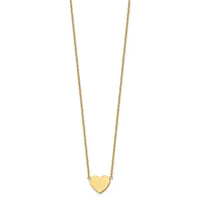 A gold heart pendant hangs from a delicate gold chain against a white background.