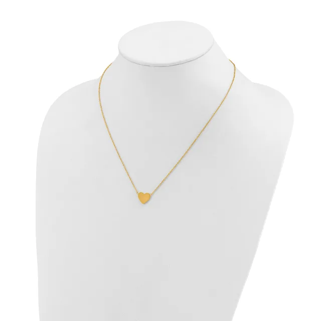 A gold-toned heart pendant necklace displayed on a white mannequin bust.