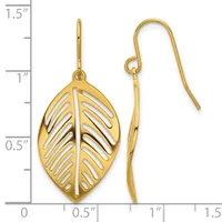 Pair of gold-toned leaf-shaped dangle earrings with cutout vein details and hook-style ear wires, displayed against a measurement ruler.