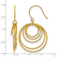 A pair of gold-toned concentric circular drop earrings displayed next to a ruler showing they measure approximately two inches in length.