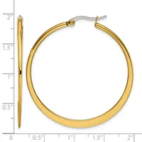 A pair of polished gold-tone hoop earrings with surgical steel posts, approximately two inches in diameter, displayed against a measurement ruler.
