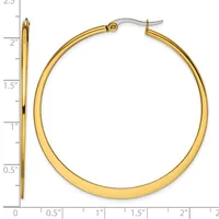 Gold-toned hoop earrings with a polished finish displayed next to a ruler showing they measure approximately 2 inches in diameter.