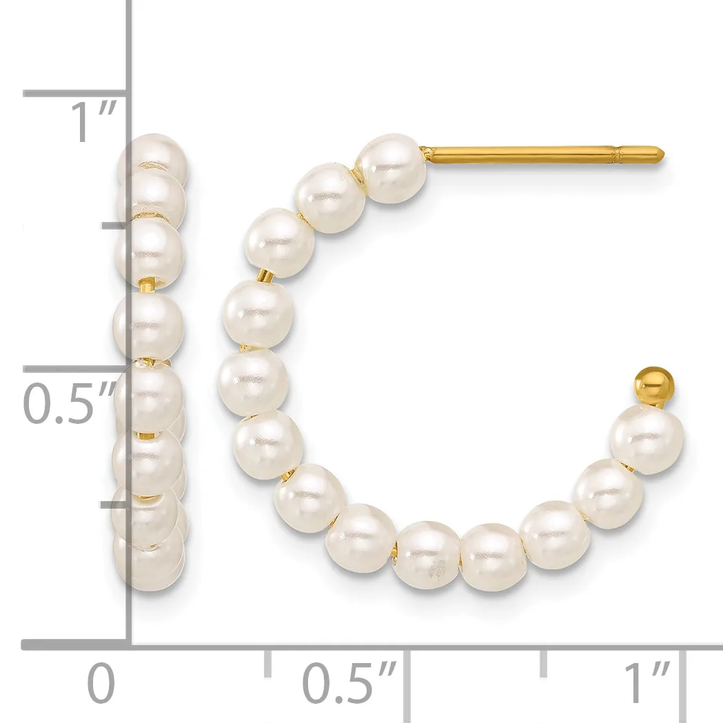 Gold stud earrings with white pearl beads arranged in curved lines, shown next to a ruler measuring approximately one inch in length.