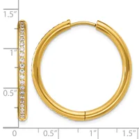 Gold hoop earrings with cubic zirconia accents along the front, shown with a measurement scale indicating approximately 1.5 inches in diameter.