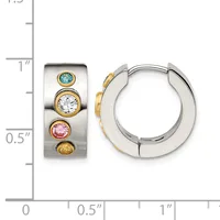 Silver and gold huggie hoop earrings with four stacked colored gemstones including blue topaz, clear, pink, and yellow stones, shown next to a measurement ruler.