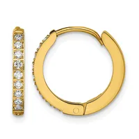 A pair of gold hoop earrings with a hinged closure, lined with round white diamonds set in a channel setting along the inner edge.