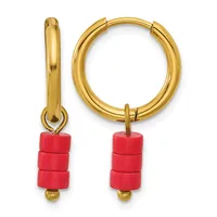 Pair of gold-toned hoop earrings with red cylindrical beads hanging from the bottom and small gold beads at the ends.