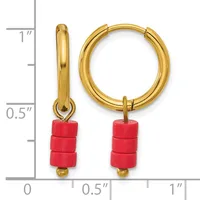 Gold-toned hoop earrings with red cylindrical bead charms, displayed next to a ruler showing approximately one inch in length.