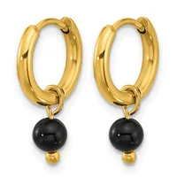 A pair of gold-toned hoop earrings with black onyx spheres and small gold beads hanging from the bottom.