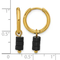 Gold-toned hoop earrings with black cylindrical beads attached, displayed next to a measurement scale showing approximately one inch in length.