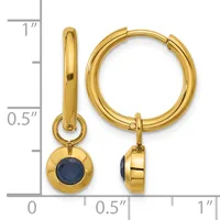 Pair of gold-colored hoop earrings with dangling round blue stone charms, shown front and side view against a measurement scale.
