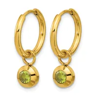 Pair of gold hoop earrings with small spherical charms featuring round green gemstones suspended from the bottom.