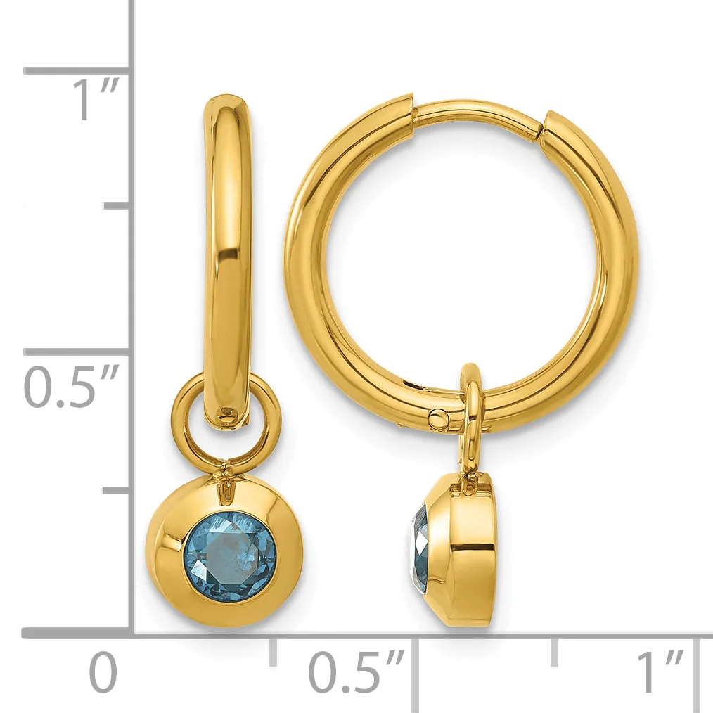 Gold hoop earrings with blue gemstone charms, shown next to a ruler indicating approximately one inch in length.