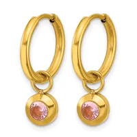 Pair of gold hoop earrings with small round pink gemstone charms hanging from the bottom.