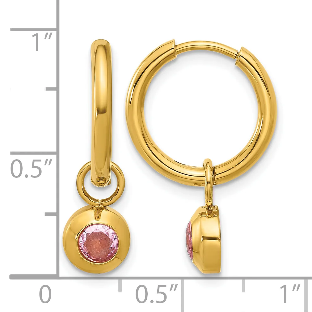 Gold hoop earrings with pink tourmaline gemstone charms, shown next to a ruler indicating approximately one inch in length.