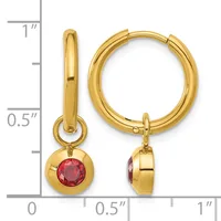 Gold hoop earrings with red gemstone charms hanging from the hoops, shown next to a measurement scale.