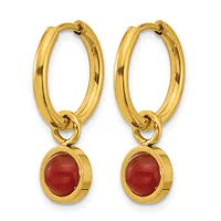 Pair of gold hoop earrings with oval red stone pendants hanging from the bottom.