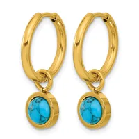 A pair of gold hoop earrings with turquoise stone pendants hanging from the bottom.