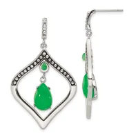 Pair of silver dangle earrings with diamond-studded posts, featuring teardrop-shaped green jade stones suspended within ornate diamond-bordered frames.