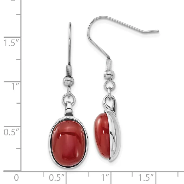 Pair of silver-toned dangle earrings with oval red stone cabochons, shown next to a ruler measuring approximately 1.5 inches in length.