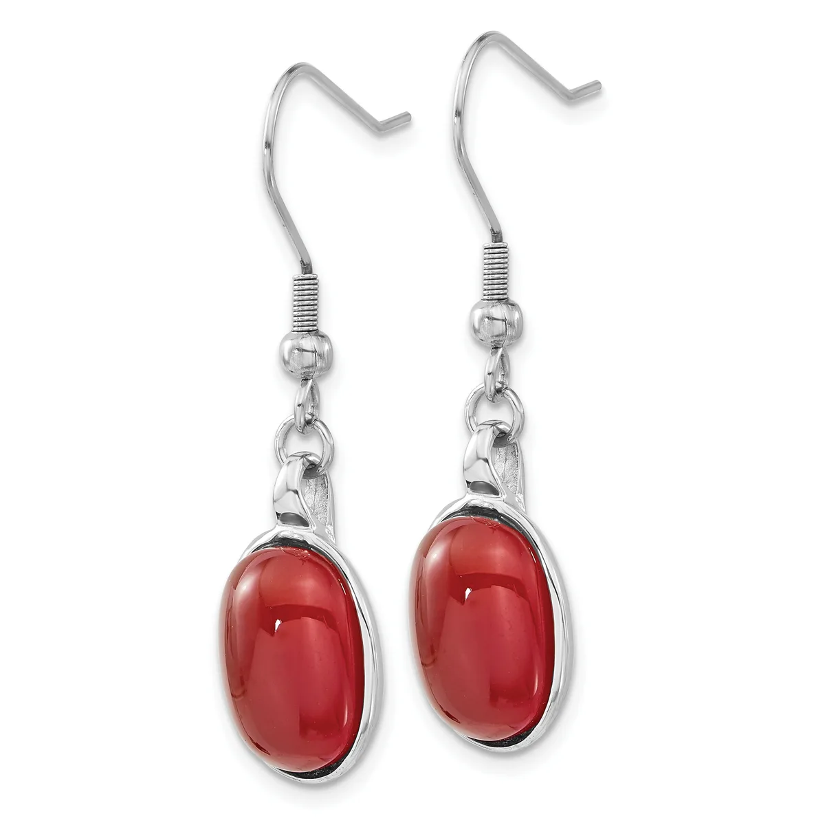 A pair of silver-toned dangle earrings with red oval cabochon stones suspended from fish hook wires.