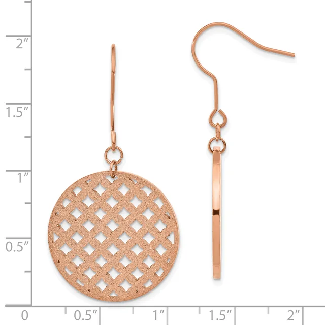 A pair of rose gold earrings with a circular lattice-patterned disc pendant and matching bar-shaped drop, shown against a measurement scale.