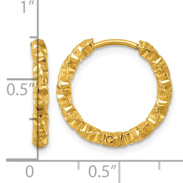 A pair of gold hoop earrings with a textured hammered finish, displayed with measurement scale showing approximately one inch in length and half inch in width.