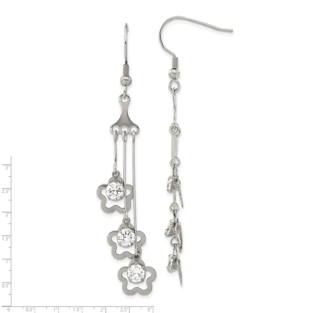 A pair of silver drop earrings with fish hook wires featuring three cascading flower-shaped charms, each set with a round cubic zirconia stone, displayed against a measurement scale.