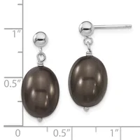 A pair of silver stud earrings with dark gray pearl drops displayed next to a measurement ruler showing approximately one inch in length.