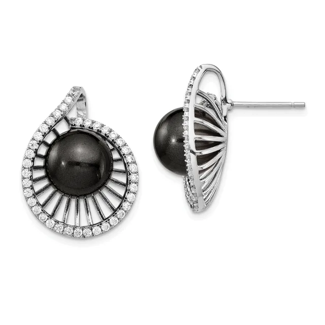 Pair of silver stud earrings featuring black onyx spheres surrounded by radiating ridged metal rays and a border of round white diamonds.