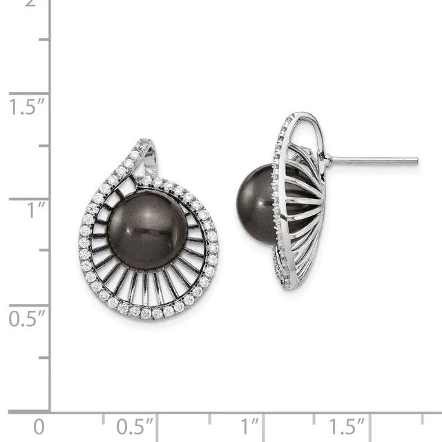 A pair of silver stud earrings with dark gray pearl centers surrounded by radiating ribbed metalwork and pavé-set cubic zirconia halos, displayed against a measurement scale.
