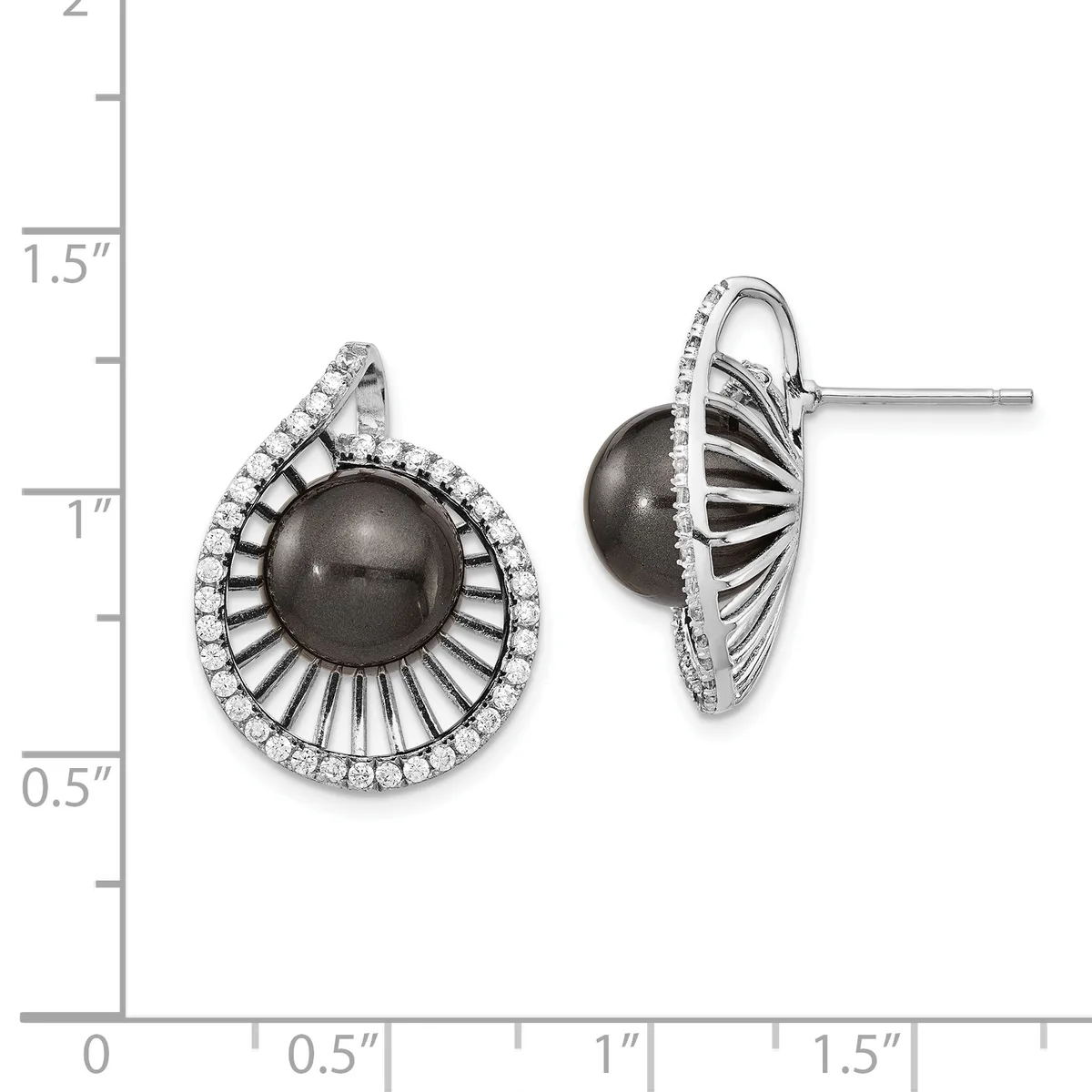 A pair of silver stud earrings with dark gray pearl centers surrounded by radiating ribbed metalwork and pavé-set cubic zirconia halos, displayed against a measurement scale.