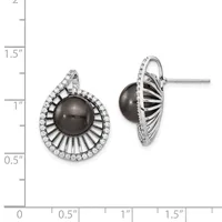 A pair of silver stud earrings with dark gray pearl centers surrounded by radiating ribbed metalwork and pavé-set cubic zirconia halos, displayed against a measurement scale.