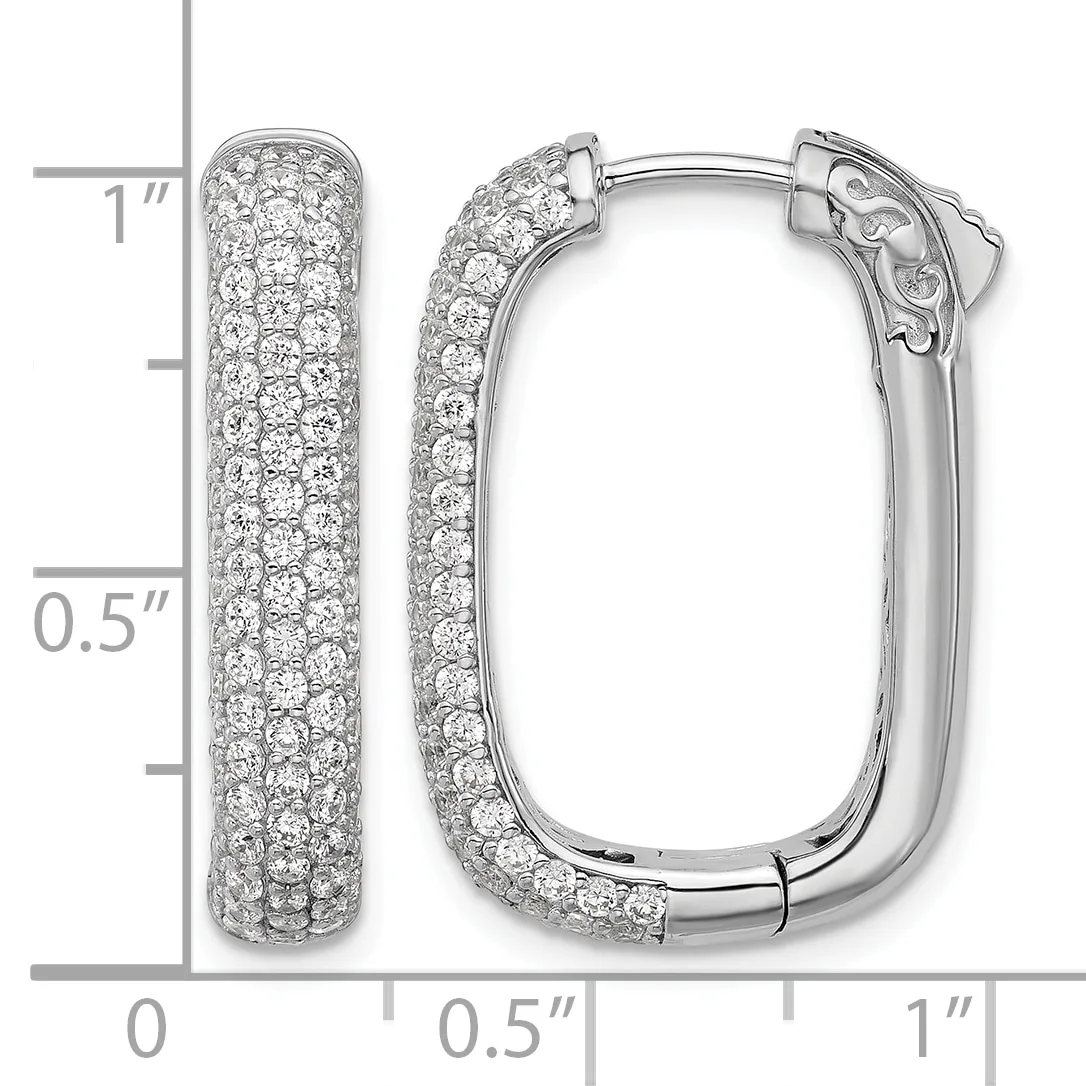 Pair of white metal hoop earrings densely covered with round diamonds, shown open and closed with a measurement scale indicating approximately one inch in length.
