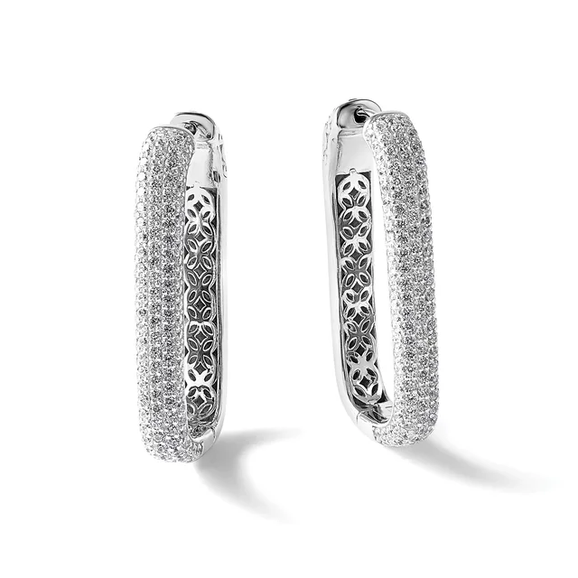 A pair of silver hoop earrings with textured glittery outer surfaces and ornate filigree pattern visible on the inner edges, shown from front and back views.