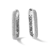 A pair of silver hoop earrings with textured glittery outer surfaces and ornate filigree pattern visible on the inner edges, shown from front and back views.