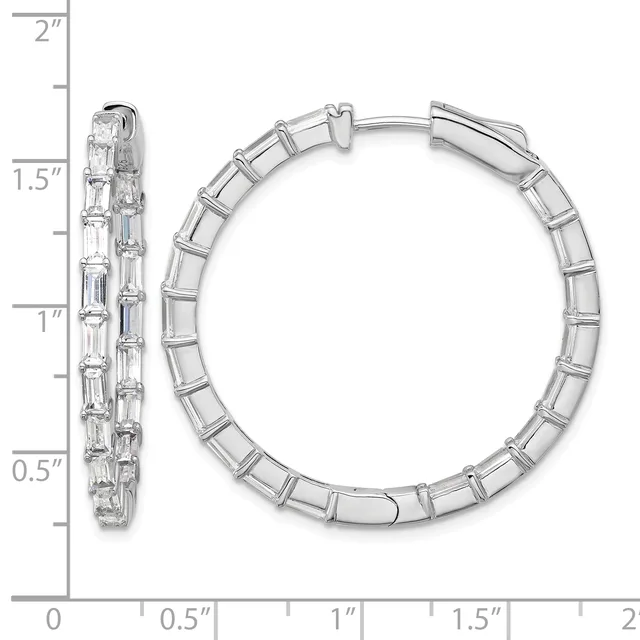 A pair of silver hoop earrings with rectangular baguette-cut cubic zirconia stones set along the outer surface, shown with a measurement scale indicating approximately 1.5 inches in diameter.