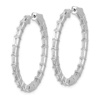 A pair of silver hoop earrings with rectangular baguette-cut crystals set along the outer surface, shown against a white background.