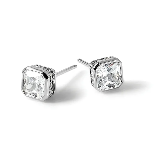 Pair of square-shaped stud earrings with large cushion-cut clear gemstones set in white metal with small decorative stones around the bezels, shown on posts against a white background.