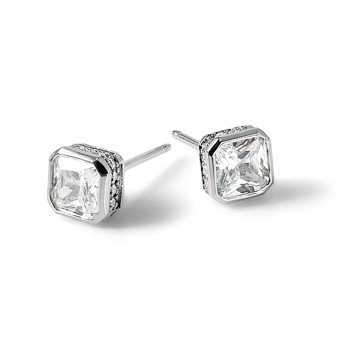 Pair of square-shaped stud earrings with large cushion-cut clear gemstones set in white metal with small decorative stones around the bezels, shown on posts against a white background.