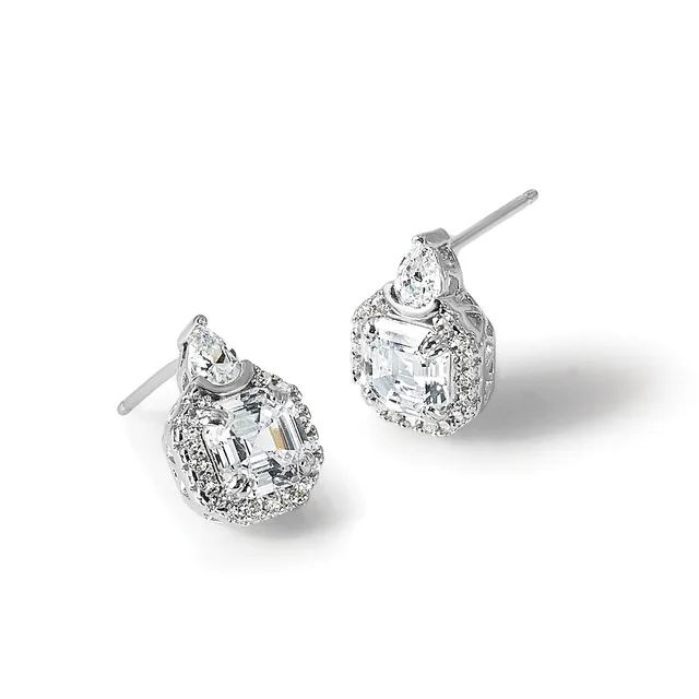 A pair of silver stud earrings with pear-shaped diamonds surrounded by smaller round diamonds in a halo setting, shown from two angles.