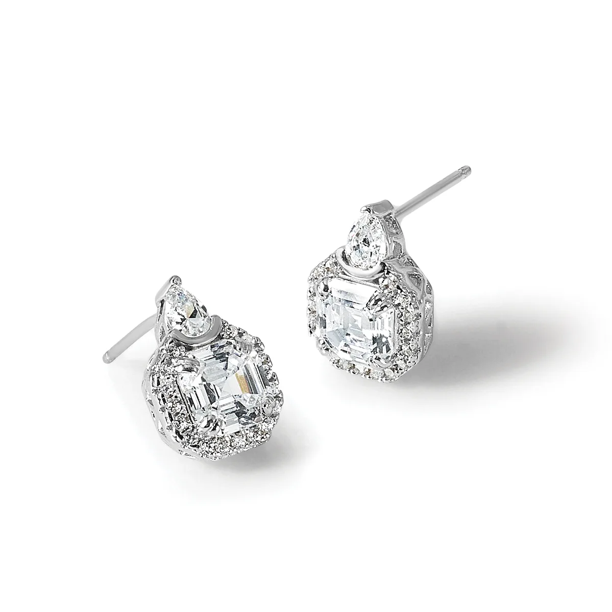 A pair of silver stud earrings with pear-shaped diamonds surrounded by smaller round diamonds in a halo setting, shown from two angles.