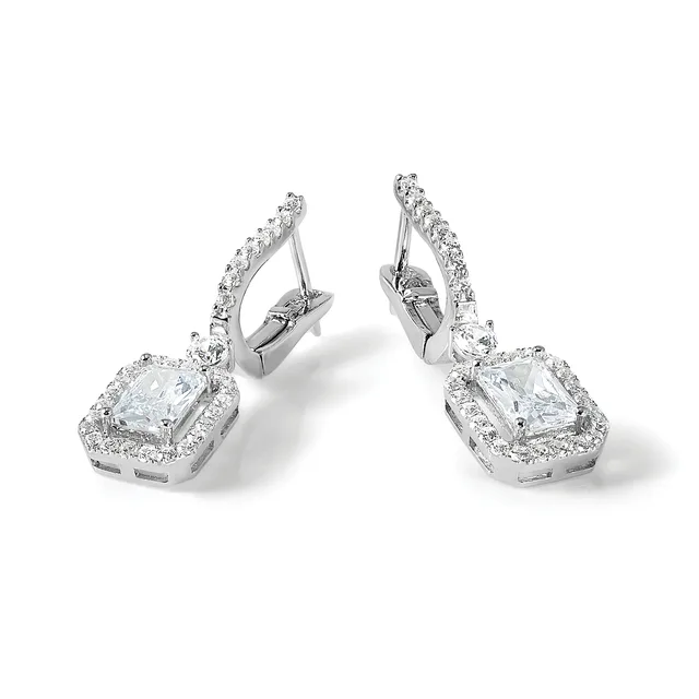 A pair of white metal drop earrings with square-cut clear gemstones surrounded by smaller diamonds, shown from a three-quarter view against a white background.