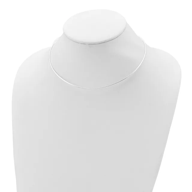 A delicate silver-toned snake chain necklace displayed on a white mannequin bust.