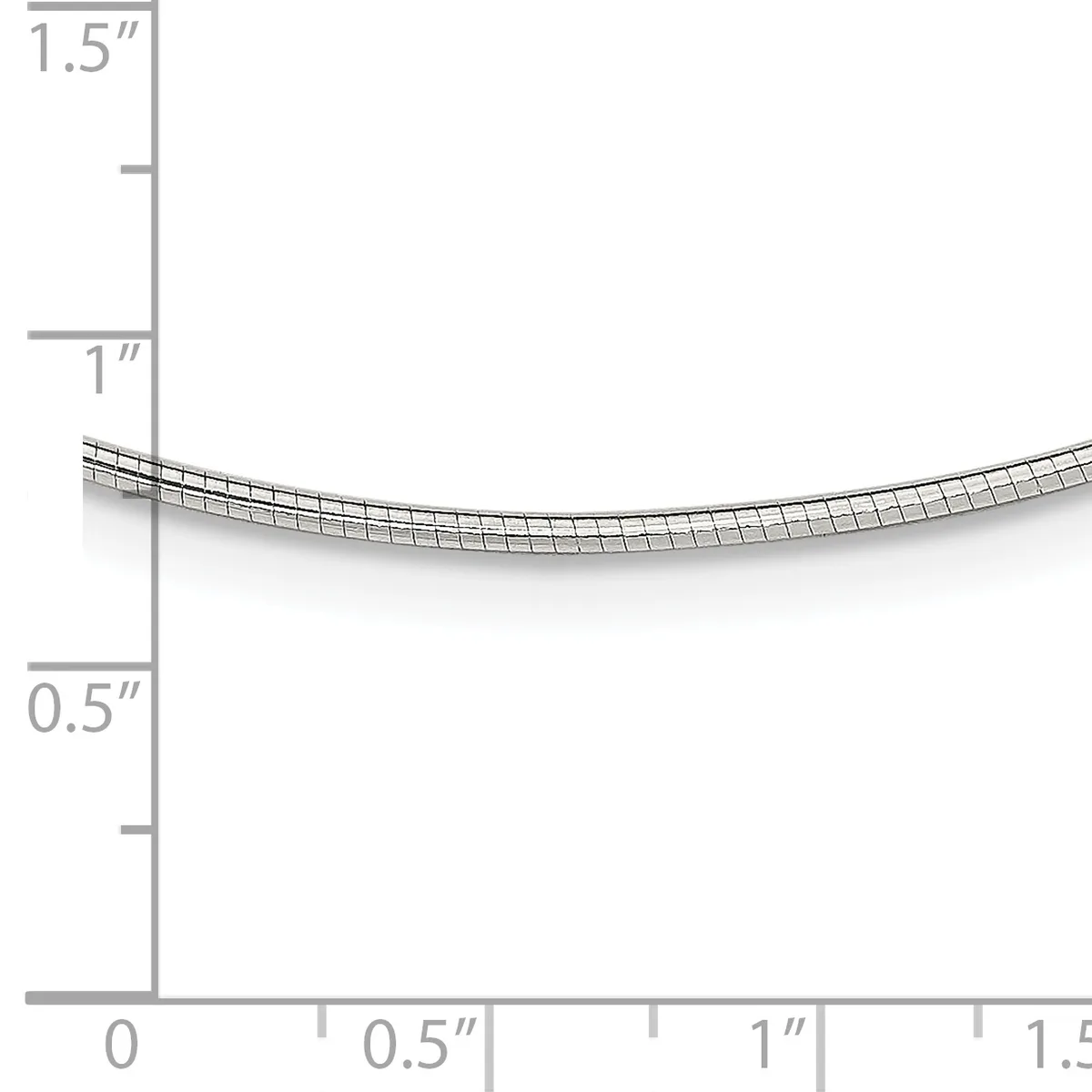 A curved metal tube or coil with a grid pattern shown against a measurement scale ranging from 0 to 1.5 inches in height and width.