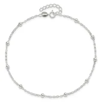 A delicate silver chain anklet with small beads spaced evenly throughout, featuring a spring ring clasp and extender chain at the top.
