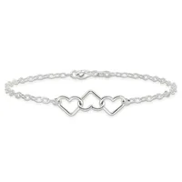 Silver-toned chain bracelet with three connected heart-shaped charms in the center and a lobster claw clasp.