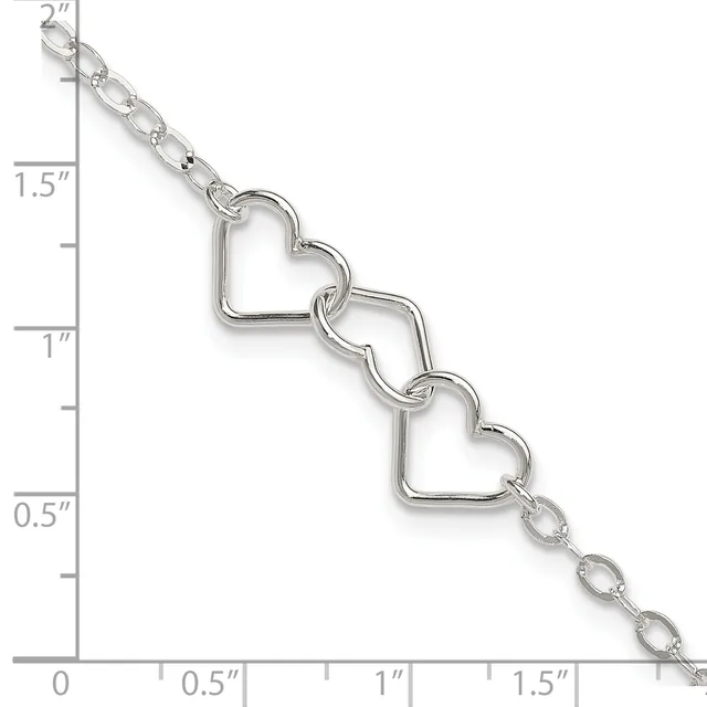 Silver-toned bracelet with three connected heart-shaped charms and delicate chain links, displayed against a measurement ruler showing approximately two inches in length.