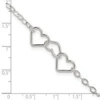 Silver-toned bracelet with three connected heart-shaped charms and delicate chain links, displayed against a measurement ruler showing approximately two inches in length.
