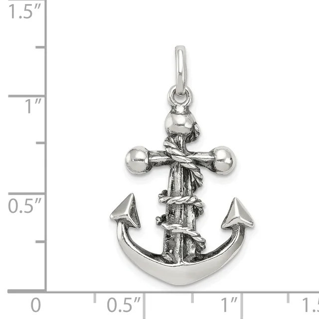 Silver anchor pendant with cross above it and rope wrapping, shown next to a ruler measuring approximately one inch in height.
